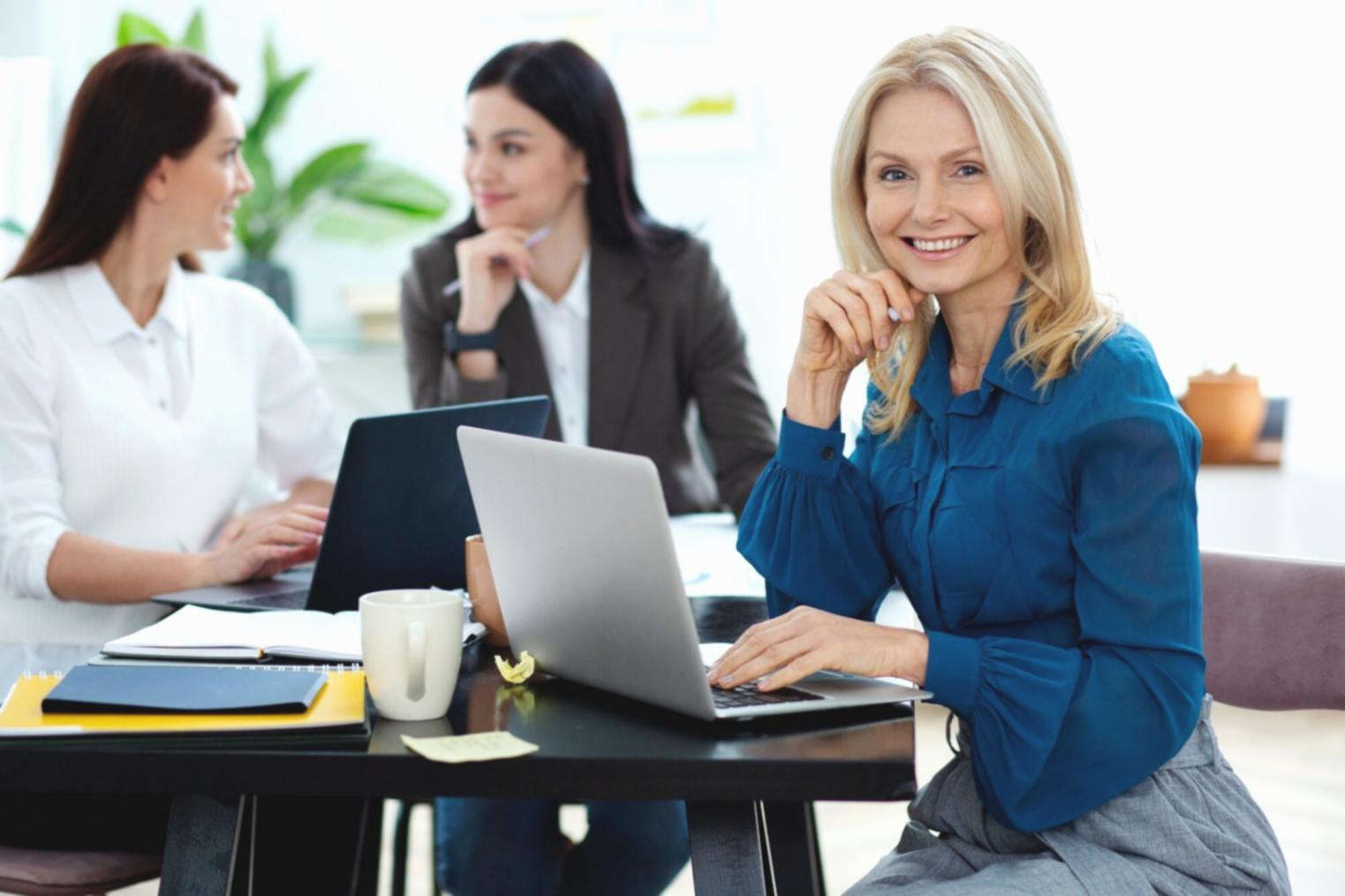 Business professionals analyzing financial charts and market data